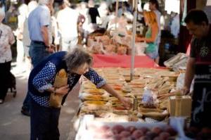 Elderly woman shopping at a farmers market